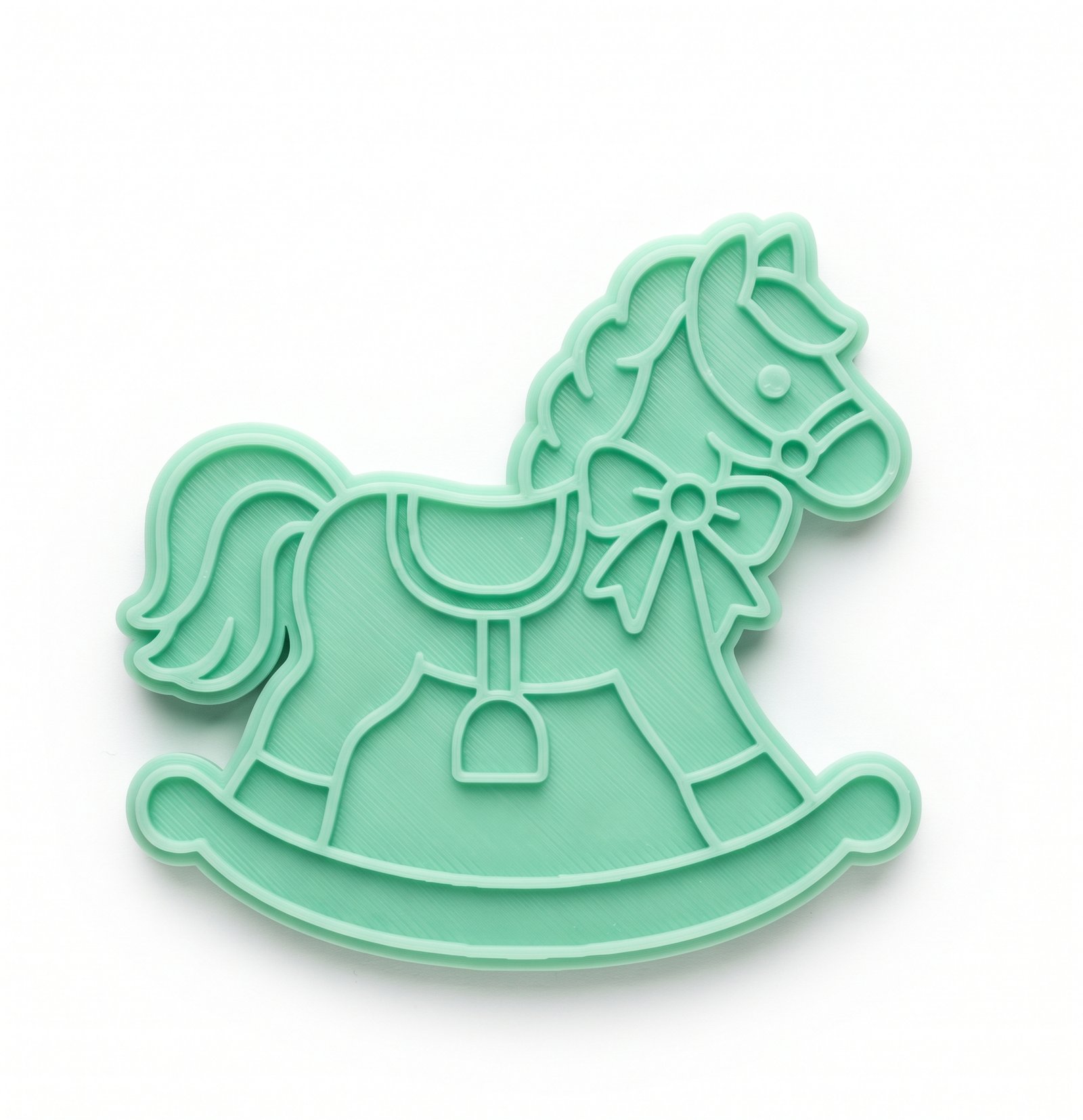 Cortador e carimbo de biscoito verde menta no formato de cavalo de balanço