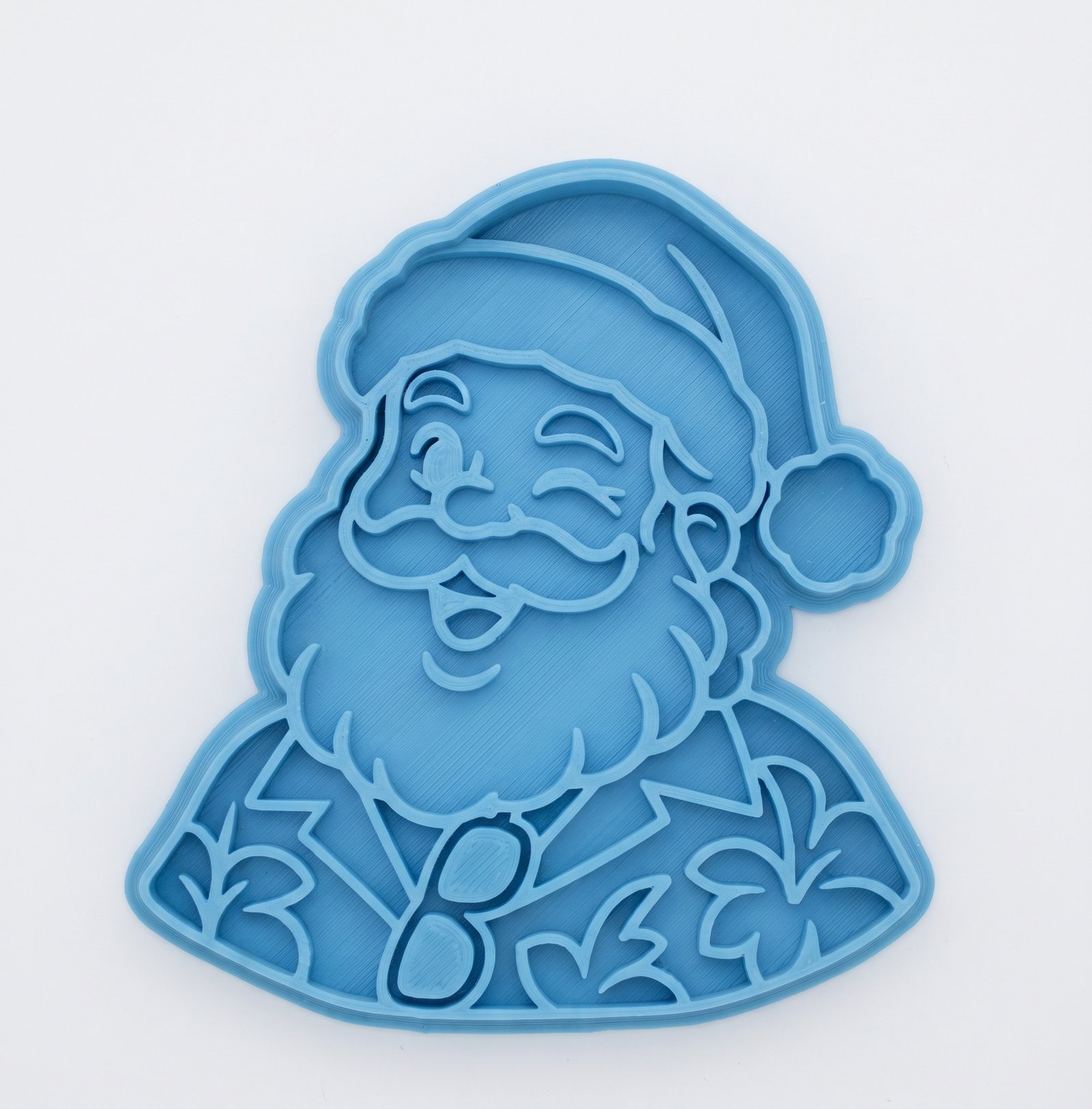 Cortador e marcador de biscoito azul em formato de Papai Noel tropical piscando